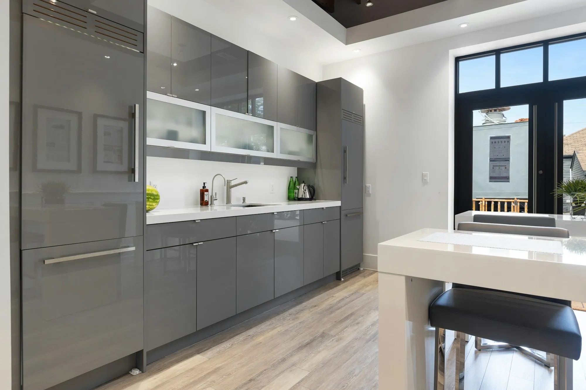 Clean office kitchen with gray cabinets