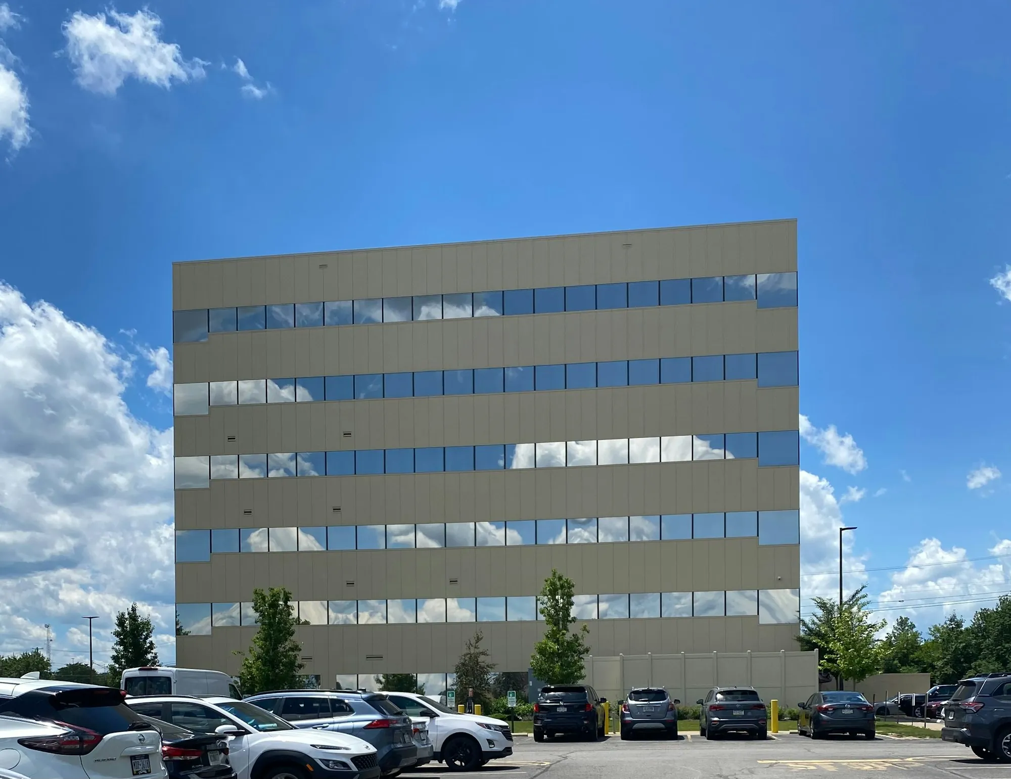 Mid-rise office building with a parking lot